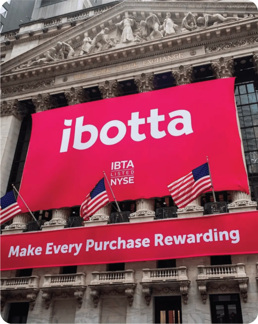 The Ibotta logo banner outside of a fancy building